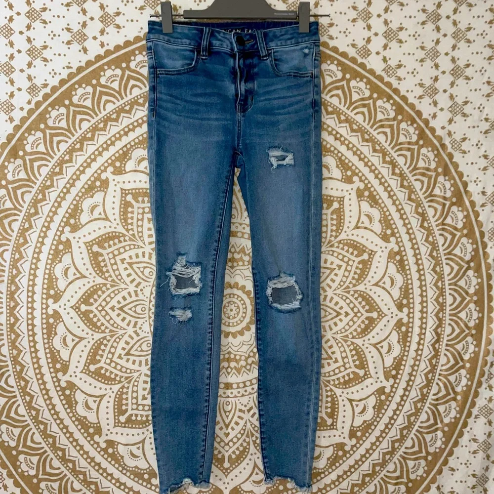 ✨HP✨ “AMERICAN EAGLE” NEXT LEVEL HI-RISE BLUE RIPPED JEGGING, LADIES SZ 2 SHORT - Picture 1 of 9